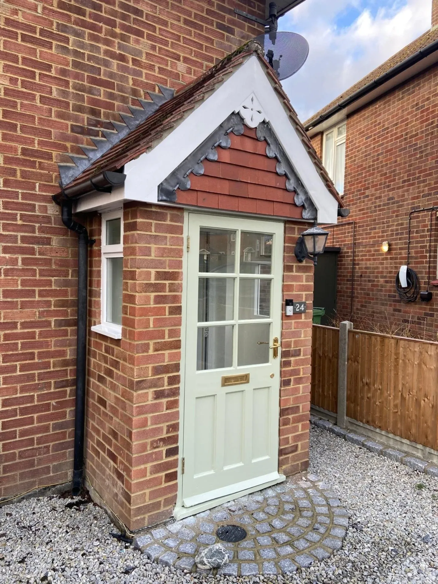 Brick house entrance with green door painted by Faughnan and Sons